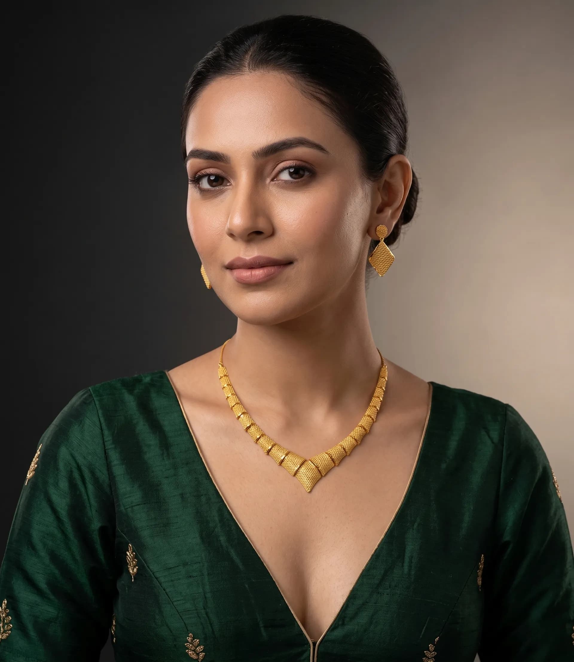 Gold jewellery with emerald attire